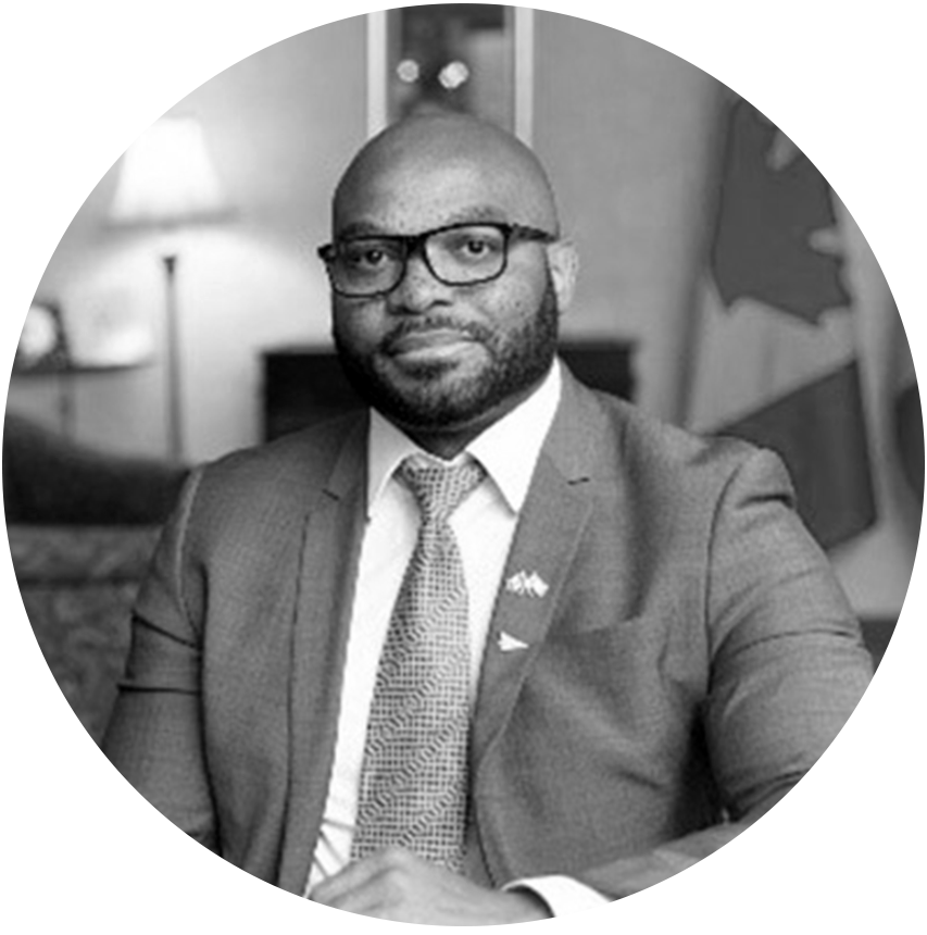 A black and white portrait of Serge Bijimine, Policy Community Champion and ADM of Policy at Transport Canada