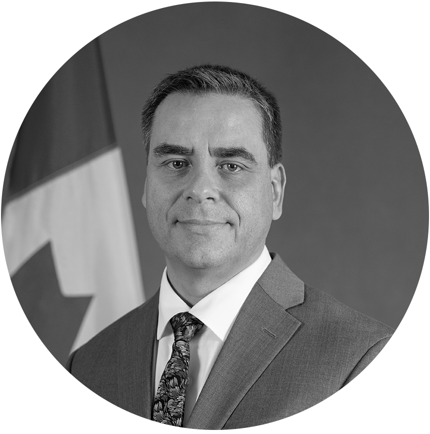 A black and white portrait of Eric Bélair, Assistant Secretary to the Cabinet, Priorities and Planning, Privy Council Office